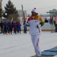 Арсеньеву передан факел Сочинской Олимпиады. Фото